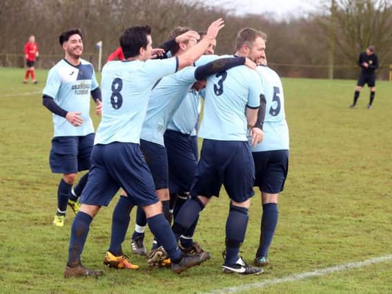Kettering Nomads celebrate after Darren Capps gave them the lead in their NFA Junior Cup semi-final success over Sileby Rangers at Orlingbury Road. Pictures by Alison Bagley