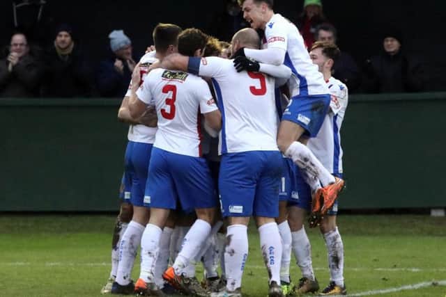 Diamonds celebrate after Ben Diamond gave them the lead against Banbury