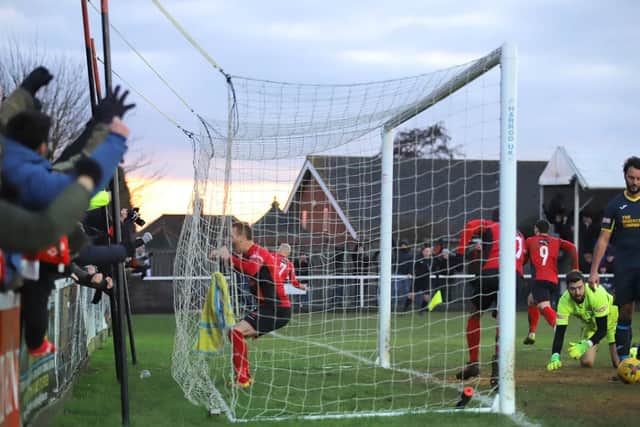 The celebrations begin after the Poppies grabbed a late goal to go five points clear at the top of the table