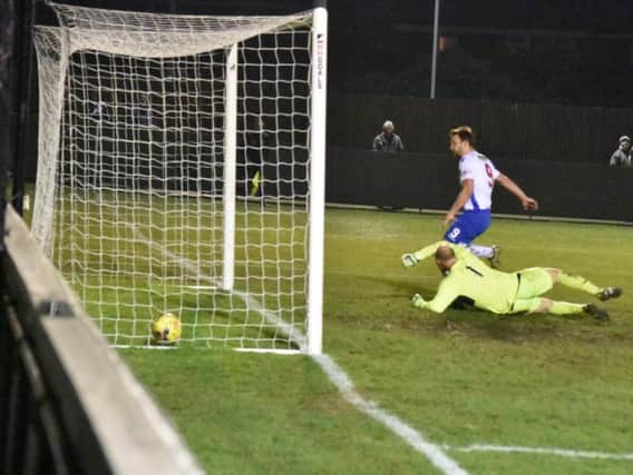 Tom Lorraine scores his second goal on his way to a first-half hat-trick in AFC Rushden & Diamonds 6-0 win over Cogenhoe United, which secured a place in this seasons NFA Hillier Senior Cup final. Picture courtesy of HawkinsImages