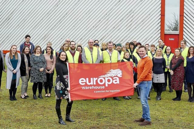 Andrew Baxter, managing director at Europa, with Menzies Response staff.