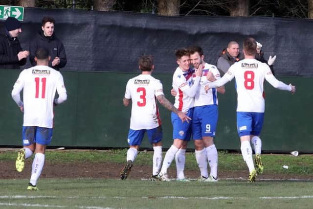 Tom Lorraine takes the congratulations after he scored AFC Rushden & Diamonds' goal in their 1-0 victory over King's Lynn Town at Steel Park. Pictures by Alison Bagley