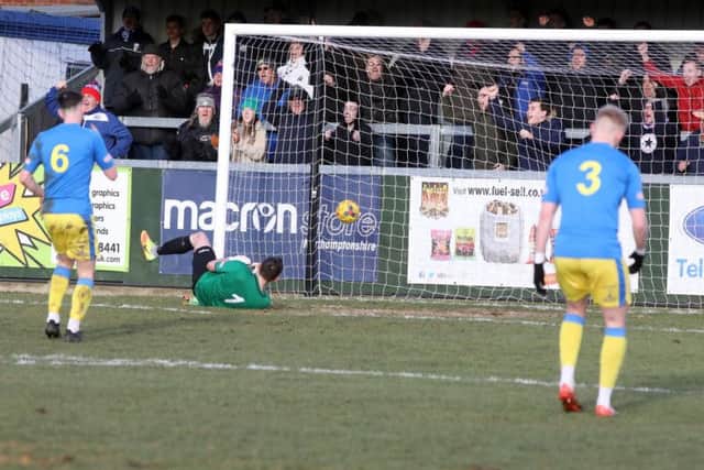 The Diamonds fans celebrate as Tom Lorraine's shot finds the net