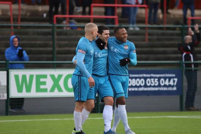 Dan Holman is congratulated by Lindon Meikle and Aaron O'Connor after he scored Kettering Town's third goal in the 4-1 success at Redditch United. Picture by Peter Short