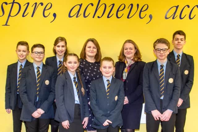 Sarah Wilson, Executive Principal at CMAT (centre left), and Angela Smith, Headteacher at The Ferrers School (centre right), with students from the Ferrers School. NNL-191002-190858005