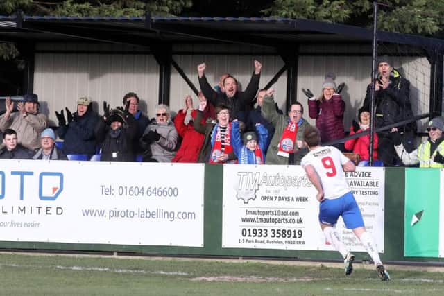 Tom Lorraine heads off to celebrate after he scored the only goal of the game in AFC Rushden & Diamonds' win over King's Lynn Town at Hayden Road. Pictures by Alison Bagley