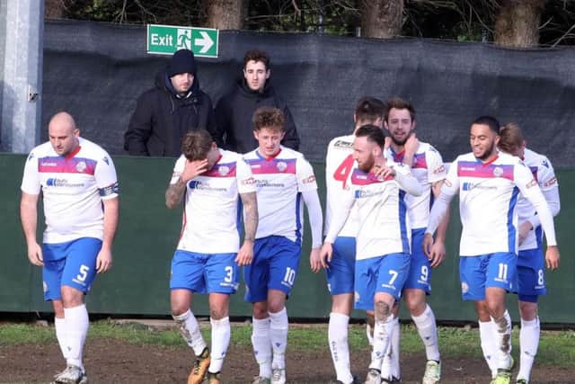 The Diamonds players celebrate Tom Lorraine's goal, his 20th of the season