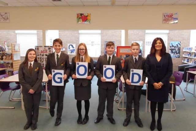 Pupils celebrate their grade of good with headteacher Meena Gabbi. NNL-191202-163726005