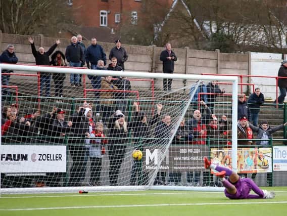 The ball is in the net after Dan Holman scored Kettering Town's third goal in last weekend's 4-1 success at Redditch United. Pictures by Peter Short