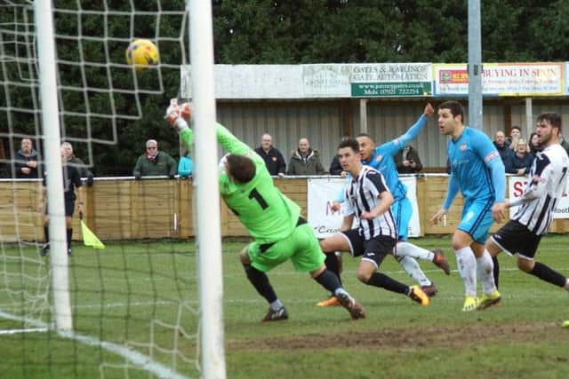 Rhys Hoenes fires home what proved to be the winning goal as Kettering Town claimed a 2-1 success at St Ives Town. Pictures by Peter Short
