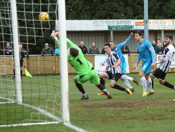 Rhys Hoenes fires home what proved to be the winning goal as Kettering Town claimed a 2-1 success at St Ives Town. Pictures by Peter Short