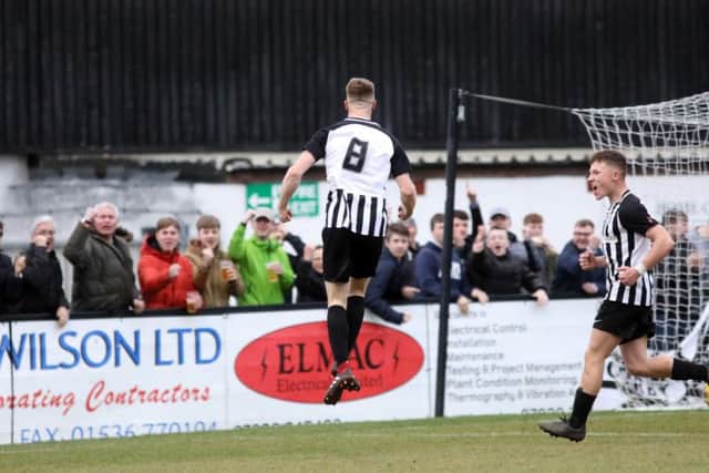 Connor Kennedy jumps for joy after scoring Corby Town's third goal in the 3-2 victory over Didcot Town at Steel Park. Pictures by Alison Bagley