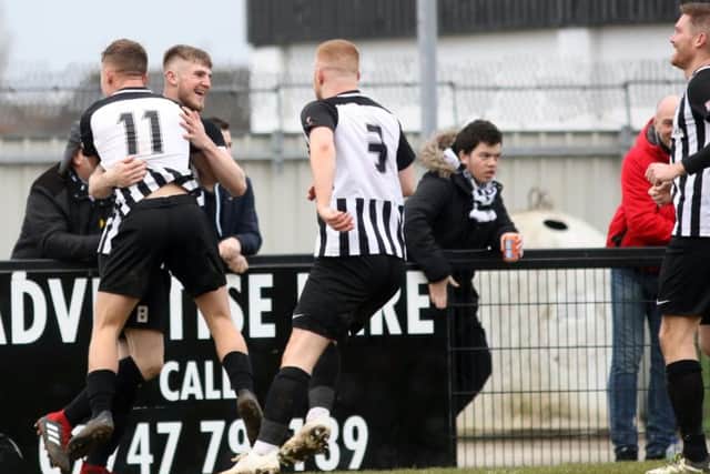 Corby Town celebrate Connor Kennedy's goal, which put them 3-1 up in the 3-2 success over Didcot Town at Steel Park. Pictures by Alison Bagley