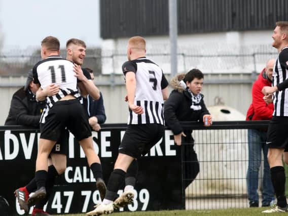 Corby Town celebrate Connor Kennedy's goal, which put them 3-1 up in the 3-2 success over Didcot Town at Steel Park. Pictures by Alison Bagley