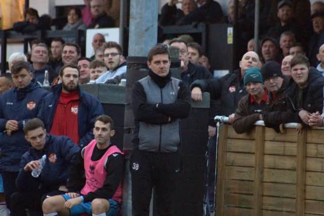 Marcus Law watches on from the sidelines