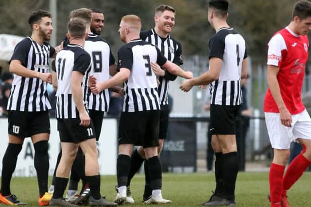The Corby players celebrate Jordan Francis' goal