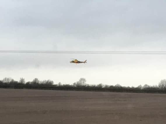 The Air Ambulance coming into land near the scene