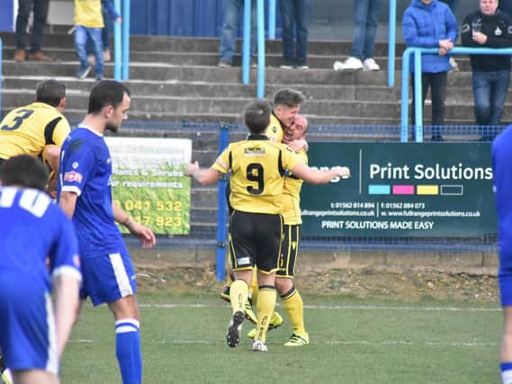 Ben Diamond gets a lift from Liam Dolman after he scored the only goal of the game to give AFC Rushden & Diamonds a victory at Halesowen Town. Picture courtesy of HawkinsImages