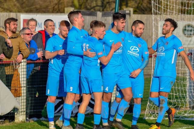 The Corby Town players celebrate Joel Carta's goal during the 3-1 success at Kempston Rovers. Pictures by Jim Darragh