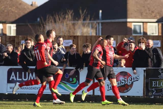 Aaron O'Connor celebrates after he grabbed the opening goal in Kettering Town's dramatic 2-1 victory over Rushall Olympic. Pictures by Peter Short