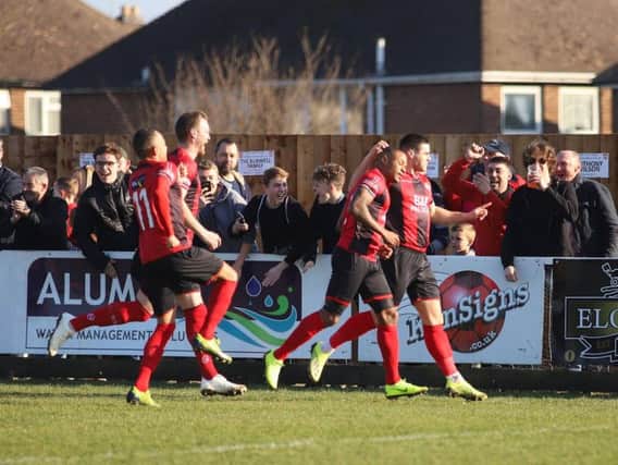 Aaron O'Connor celebrates after he grabbed the opening goal in Kettering Town's dramatic 2-1 victory over Rushall Olympic. Pictures by Peter Short