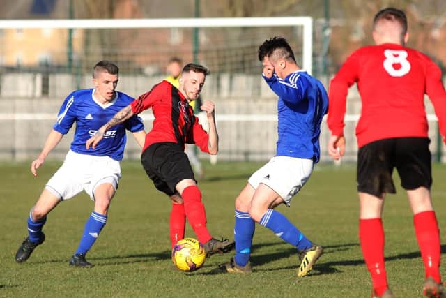 Match action from the clash between Whitworth and Rothwell Corinthians