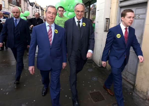 Grassroots Out: Wellingborough: MEP Nigel Farage , Peter Bone MP for Wellingborough, Tom Pursglove MP for Corby and East Northants, on a walkabout in Wellingborough before the EU referendum.