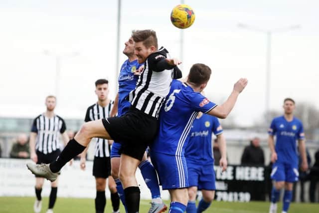 Elliot Sandy challenges for a high ball