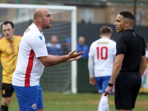 AFC Rushden & Diamonds captain Liam Dolman has a disagreement with the referee during the 1-1 draw with Alvechurch at Hayden Road. Pictures by Alison Bagley