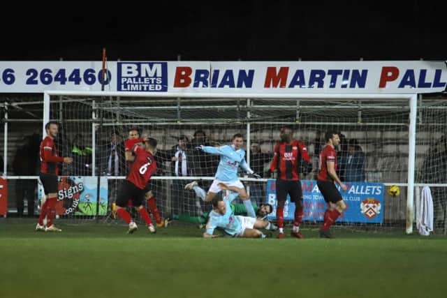 Kyle Perry scores the late winner as Coalville Town inflicted a 3-2 defeat on Kettering Town at Latimer Park. Pictures by Peter Short