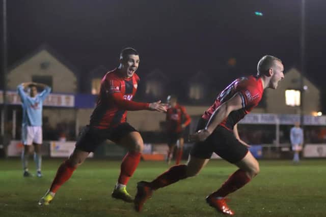 Marcus Kelly heads off to celebrate after he put the Poppies 2-1 up