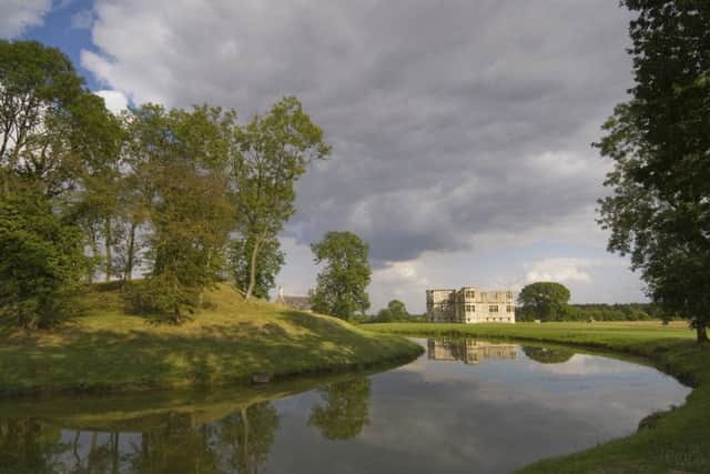 The Water Garden with the building beyond at Lyveden New Bield, Northamptonshire. The garden lodge and garden were created between 1595 and 1605 when the owner Sir Thomas Tresham died.