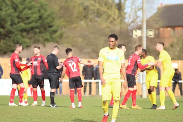 Former Poppies player Edmund Hotter heads for an early shower after the Banbury United midfielder was sent-off in the first half