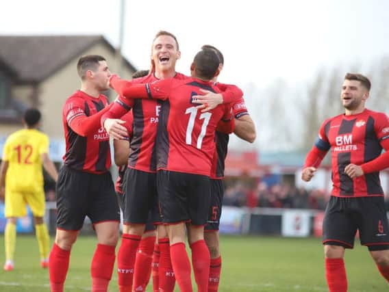 Brett Solkhon takes the congratulations after he scored Kettering Town's third goal in the 3-0 success over Banbury United at Latimer Park. Pictures by Peter Short