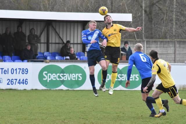 Tom Lorraine challenges for a high ball during AFC Rushden & Diamonds' 1-0 defeat at Stratford Town. Picture courtesy of HawkinsImages