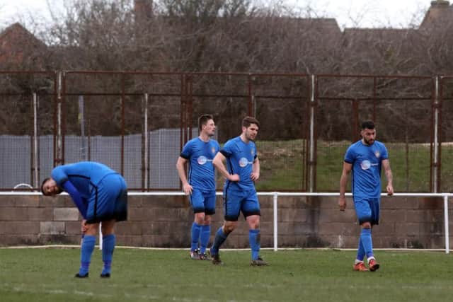 The Desborough Town players look dejected after conceding a goal in the 2-0 home defeat to Daventry Town in the UCL Premier Division. Pictures by Alison Bagley