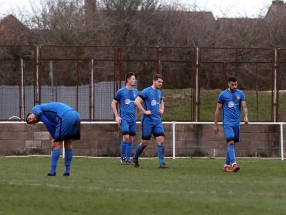 The Desborough Town players look dejected after conceding a goal in the 2-0 home defeat to Daventry Town in the UCL Premier Division. Pictures by Alison Bagley