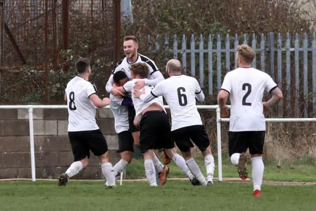 Daventry Town's players celebrate a goal in the win at the R Inn Stadium