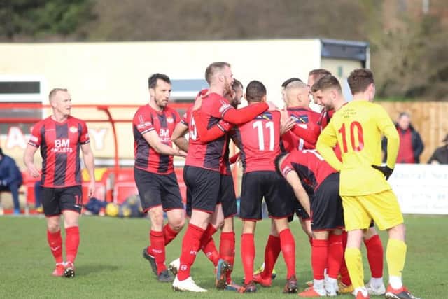 Man-of-the-match Gary Stohrer takes the congratulations after he scored Kettering Town's second goal in the 3-0 win over Banbury United. Pictures by Peter Short