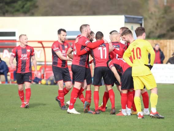 Man-of-the-match Gary Stohrer takes the congratulations after he scored Kettering Town's second goal in the 3-0 win over Banbury United. Pictures by Peter Short