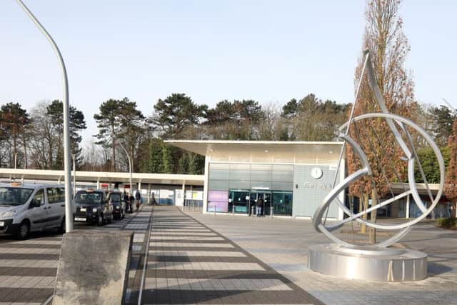 One end of Corby Walk (the striped paving) is at Corby rail station.