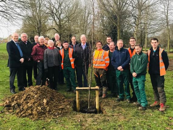 Corby Borough and Kettering Borough councillors together with officers from the new shared service team and members of the Friends of Coronation Park group plant new trees as part of the makeover