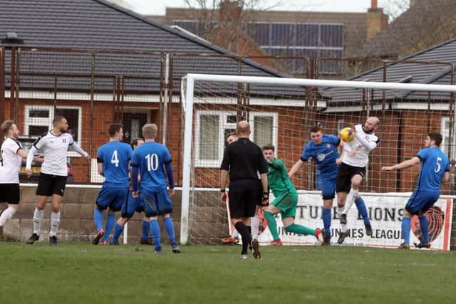 Goalmouth action from Desborough Town's 2-0 home defeat to leaders Daventry Town in the UCL Premier Division last weekend. Pictures by Alison Bagley