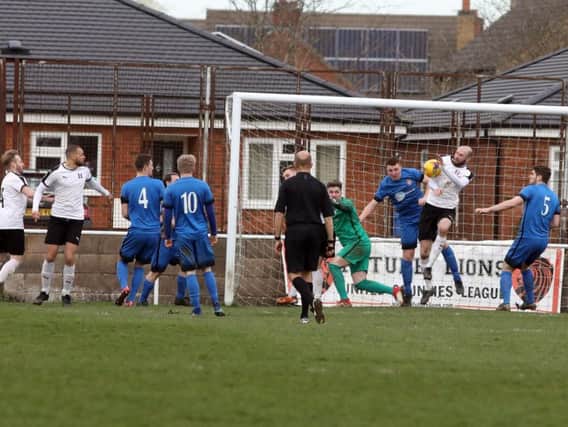 Goalmouth action from Desborough Town's 2-0 home defeat to leaders Daventry Town in the UCL Premier Division last weekend. Pictures by Alison Bagley