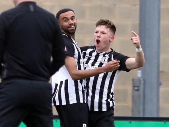 Hat-trick hero Jordon Crawford celebrates the first of his three goals in Corby Town's 5-2 victory over North Leigh at Steel Park. Pictures by Alison Bagley