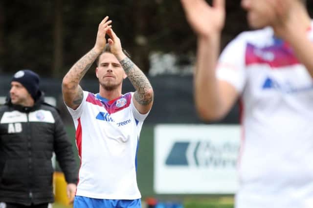 Declan Rogers, who scored AFC Rushden & Diamonds' first goal, applauds the fans after they completed a 2-1 victory over Needham Market. Pictures by Alison Bagley