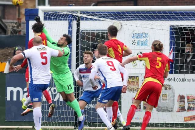 Ben Heath punches the ball away during Diamonds' win