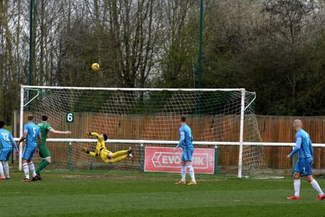 Poppies goalkeeper Paul White makes a save during the loss at Biggleswade
