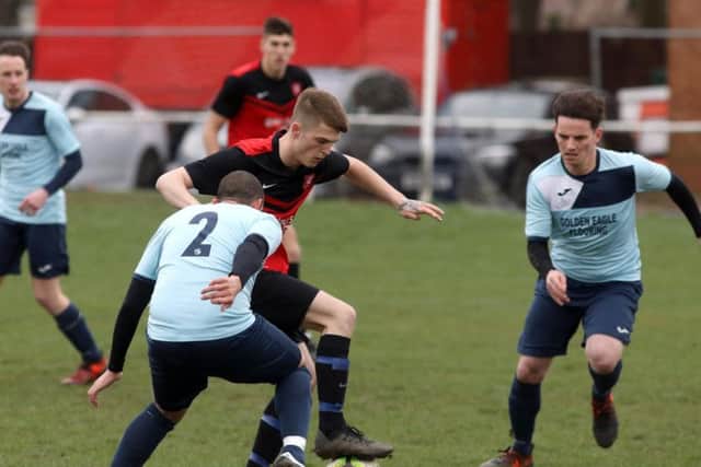 Action from the Premier Division clash between S&L Kingswood and Kettering Nomads