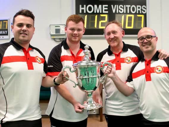 The Northants players pose with the Hilton Trophy after they helped England to victory in the British Isles International Series. From left: Jamie Walker, Connor Cinato, Andrew Manton and Neil McKee
